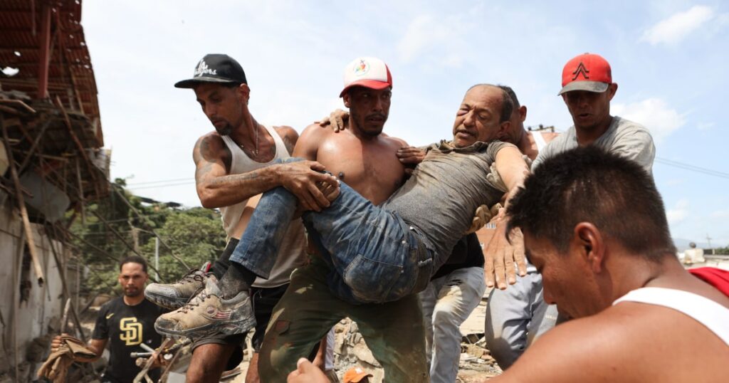 Video shows people, including children, trapped under rubble being pulled
